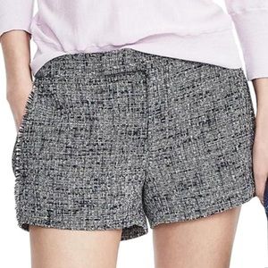 Tweed short with frayed edge pockets.